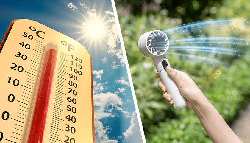 Thermometer in bright sun next to a handheld cooling device in use outdoors